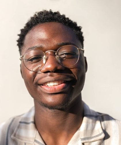headshot-of-young-happy-and-smiling-black-man-wearing-glasses-outdoors-.jpg